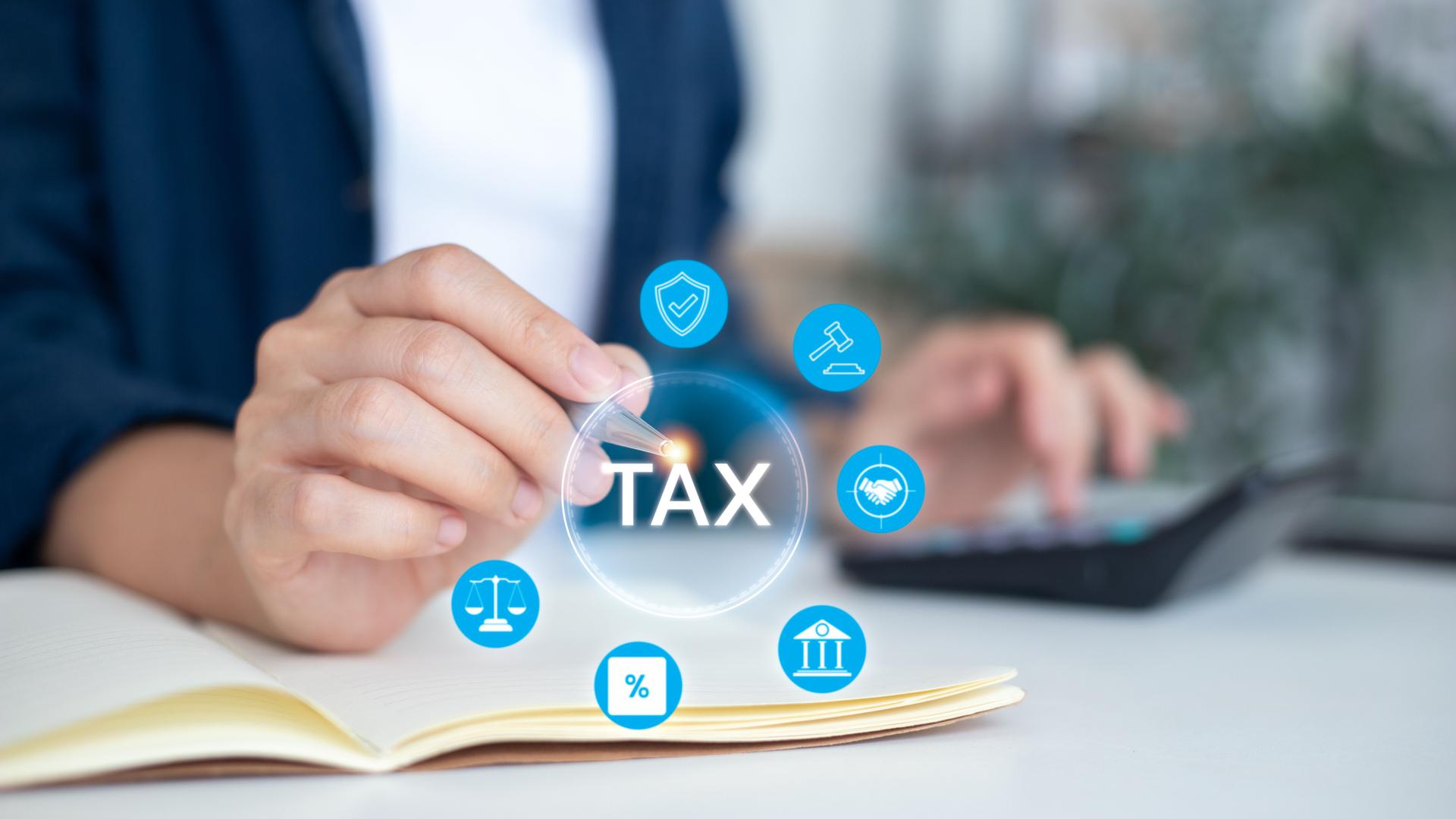 Hand holding pen with digital tax icon interface, financial planning, accounting management, business taxation, budget calculation, legal compliance and secure economic strategy for finance industry.