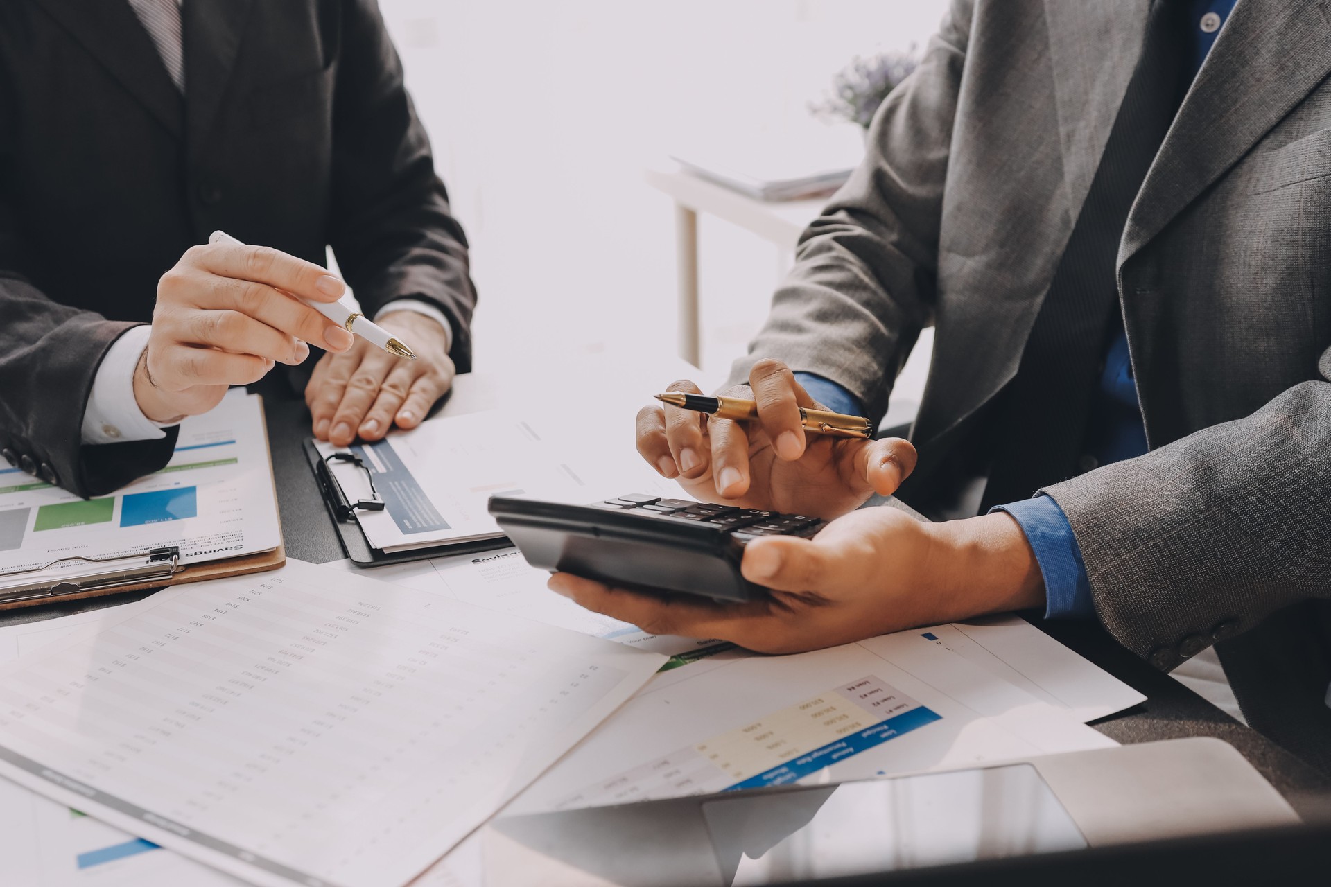 Accounting company provide finance and taxation planning for profitable cash flow, Auditor and accountant team working in office, analyze financial data and accounting record with calculator.Insight